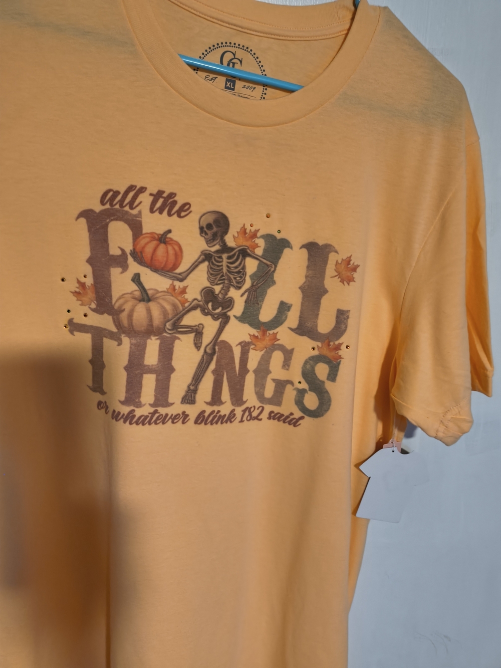 Women's Halloween Pumpkin Skeleton Graphic Tee - Peach
